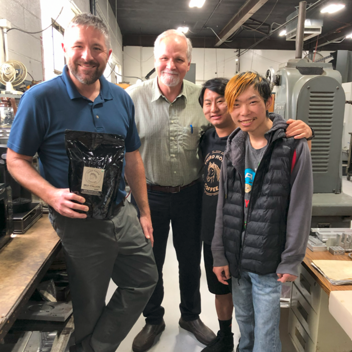 Josiah and Charlie visiting Hartzell Machine Works, a Third Horse Coffee community partner